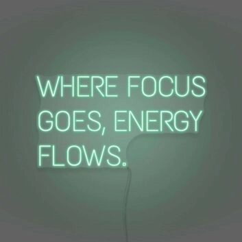 Where Focus Goes Energy Flows Neon Lettering Inspiring Concentration and Success