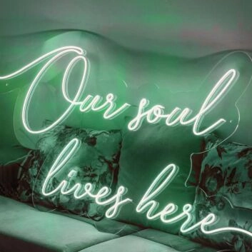 ”Our soul lives here“ neon sign