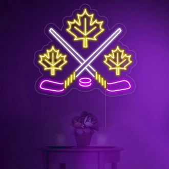 Ahornblätter mit überkreuztem Eishockeyschläger in Neonlicht