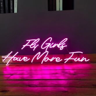 'Fly girls have more fun' neon sign