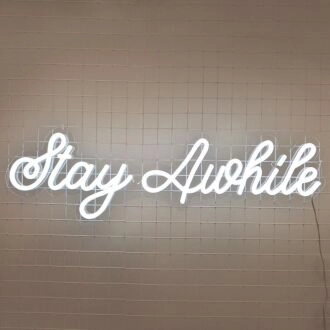 Stay Awhile Neon Sign perfect for cozy living room settings