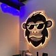 Brighten Your Bar, Office, and Home Decor with the Hip Monkey With Glasses Magic LED UV Neon Sign