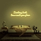 Darling, look how much you glow' neon sign