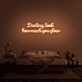 Darling, look how much you glow' neon sign