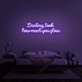 Darling, look how much you glow' neon sign