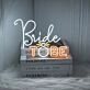 Add a captivating glow to your wedding or engagement celebration with the Bride To Be Led Neon Sign - A Memorable Backdrop and Gift.