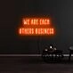We Are Each Others Business Neon Sign