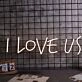 Love Us Neon Sign