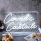 Conrad's Cocktails White Neon Sign