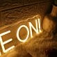 Charge On Yellow Neon Sign