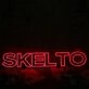 SKELTO Red Noen Sign