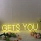 GETS YOU Yellow Neon Sign