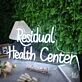Residual Health Center White Neon Sign