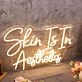 Skin Is In Aesthetics Yellow Neon Sign