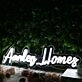 Aarden Homes White Neon Sign