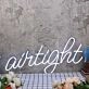 Airtight White Neon Sign