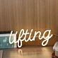 Lifting Yellow Neon Sign