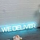 We Deliver Blue Neon Sign