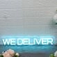 We Deliver Blue Neon Sign