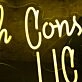 Kruah Consultants LLC Yellow Neon Sign