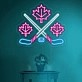 Maple leaves with crossed hockey sign in neon light