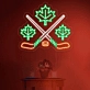 Maple leaves with crossed hockey sign in neon light