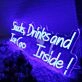 Snacks Drinks And Ice Cream Inside Blue Neon Sign
