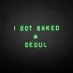 'I GOT BAKED IN SEOUL' neon sign