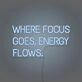 Where Focus Goes Energy Flows Neon Lettering Inspiring Concentration and Success