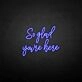 'So glad you're here' neon sign