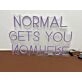 'Normal gets you nowhere' neon sign