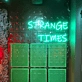 Strange Times: Illuminate Your Space with an Eccentric Vibe - Neon Sign