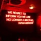 We Regret to Inform You We Are No Longer a Brothel Management Neon Sign: Changing Times in Neon