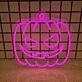 Pumpkin Head' neon sign