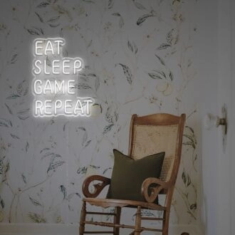 Elevate Your Gaming Zone or Den with the Vibrant Eat Sleep Game Repeat LED Neon Sign - Perfect for Parties, Home Decor, and Office Lounges.