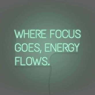Where Focus Goes Energy Flows Neon Lettering Inspiring Concentration and Success