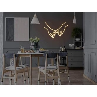 Kleine Finger feiern neues Leben mit zartem Neon.