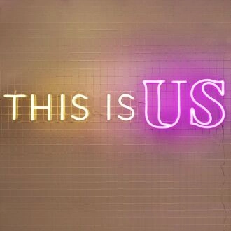 This Is Us Neon Sign for family-centered living rooms