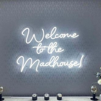 'Welcome To The Madhouse' Neon Sign