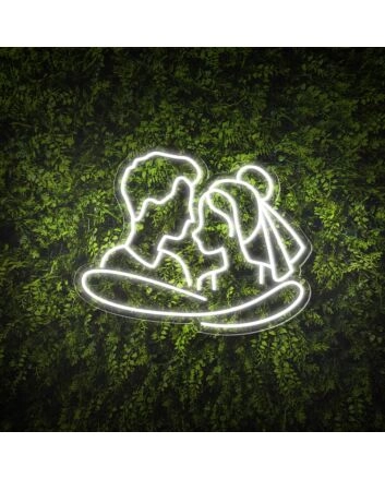 Add a Romantic Glow to Your Bedroom, Wedding, or Anniversary Celebration with the Cuddling Couple Shape Neon Sign.