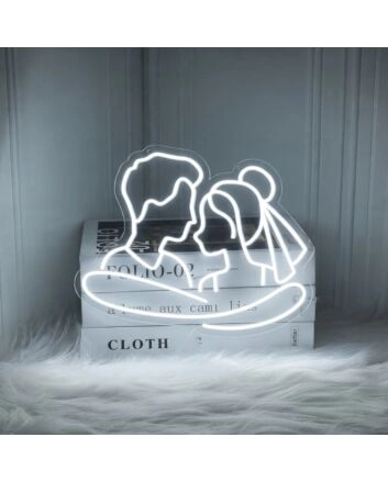 Add a Romantic Glow to Your Bedroom, Wedding, or Anniversary Celebration with the Cuddling Couple Shape Neon Sign.