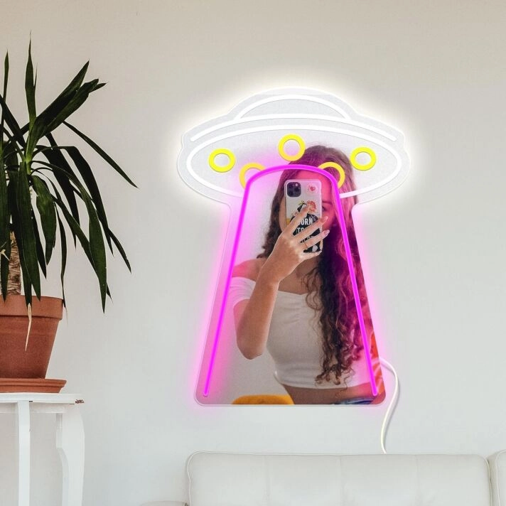 Transform your space into a vibrant haven for parties, weddings, and cozy evenings with the Cosmic Frisbee Styling Neon Mirror Sign.